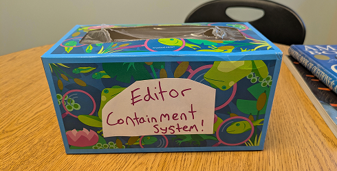 A box labeled “Editor containment system”